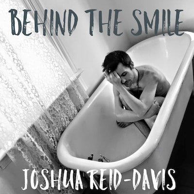 Behind The Smile – omslag till ljudboken av Joshua Reid-Davis